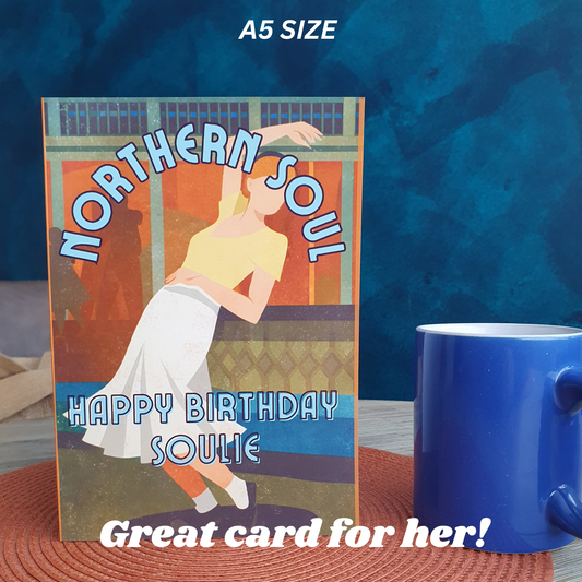 Greeting card with 'Northern Soul' design and a blue mug on a textured surface.