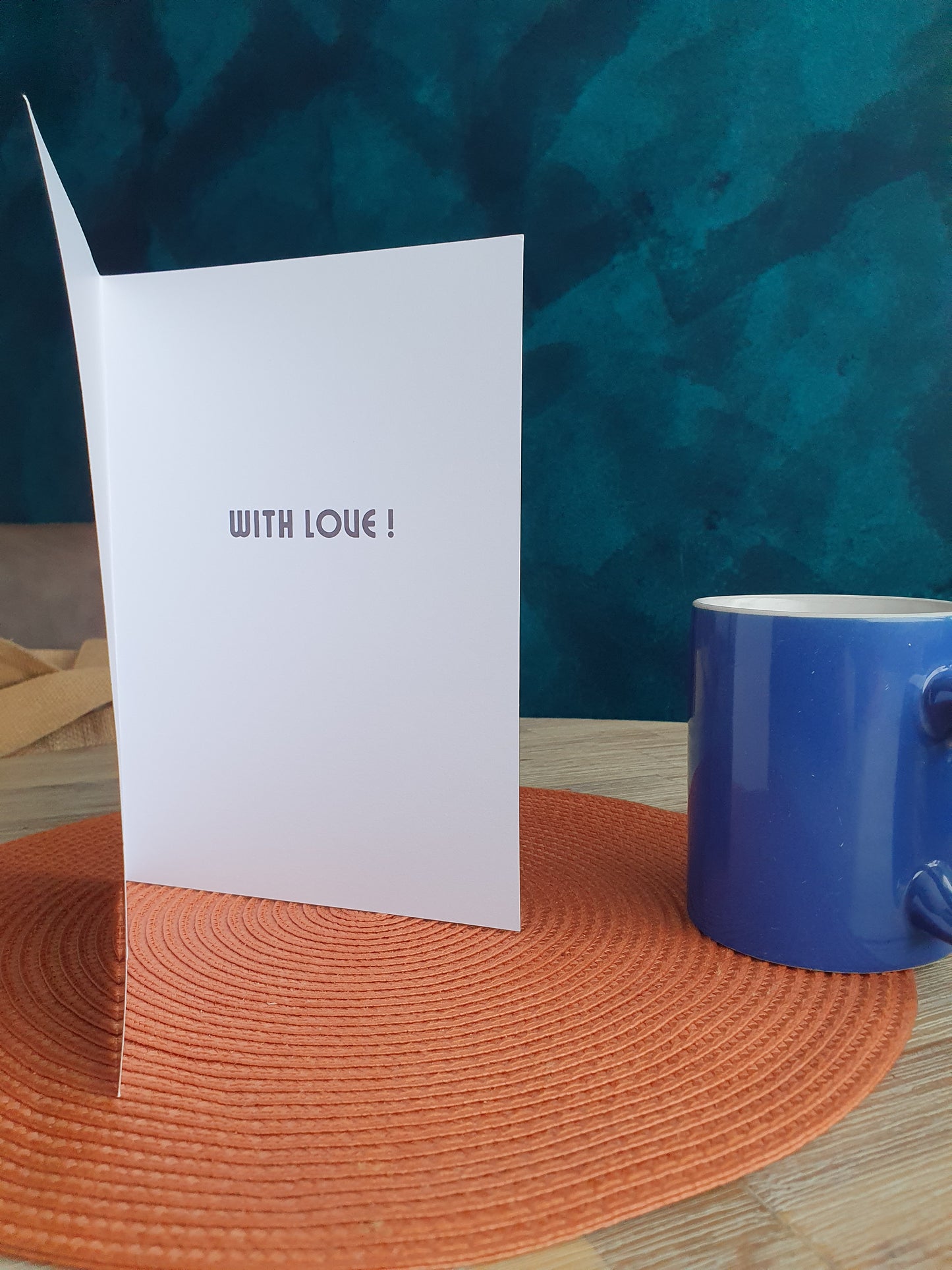 Card inner stating with love next to a blue mug
