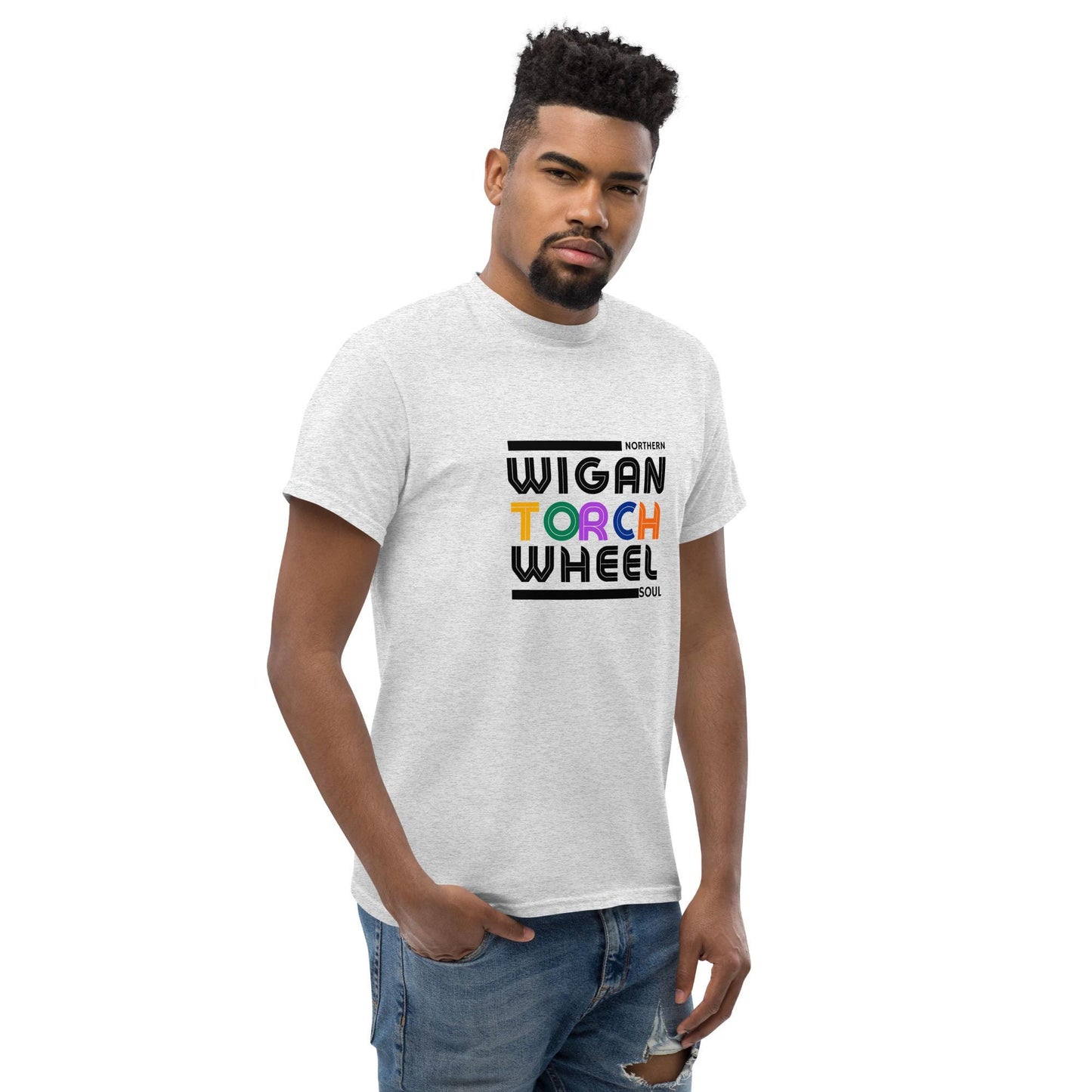 Man wearing a white t-shirt with 'Wigan Torch Wheel' text design on a white background