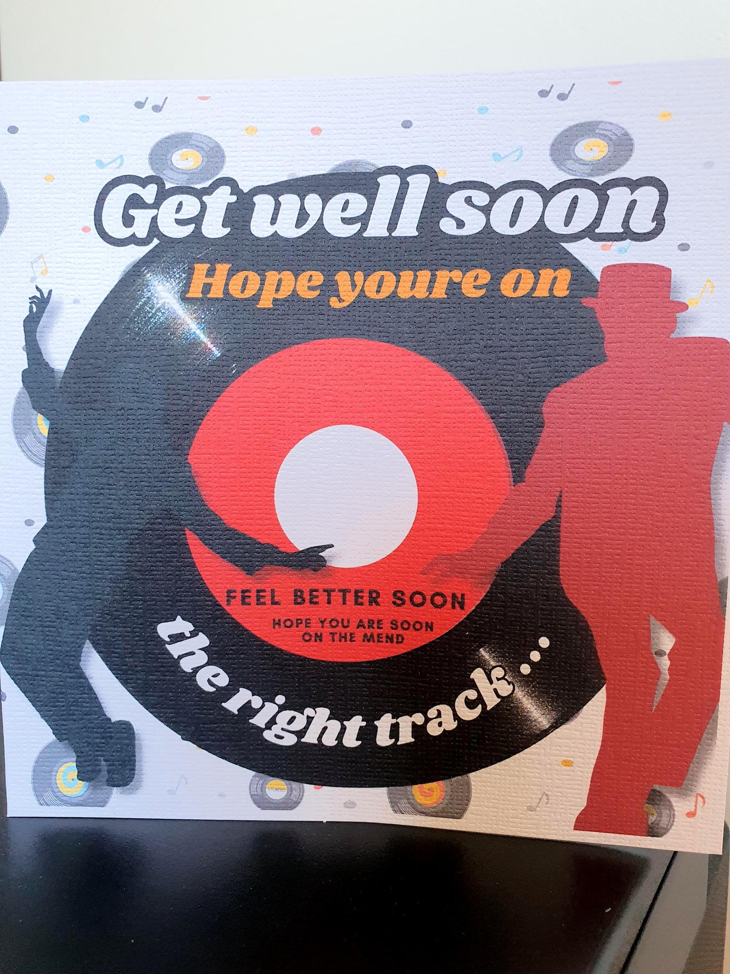 Get well soon card with vinyl record design and text