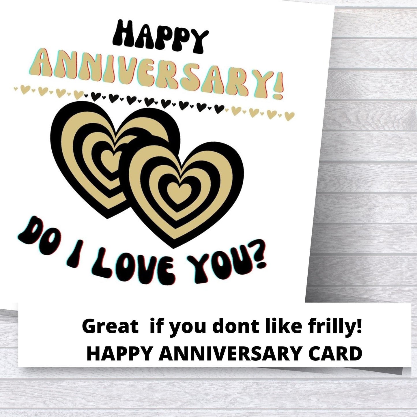 Anniversary card with gold hearts and text on a wooden surface
