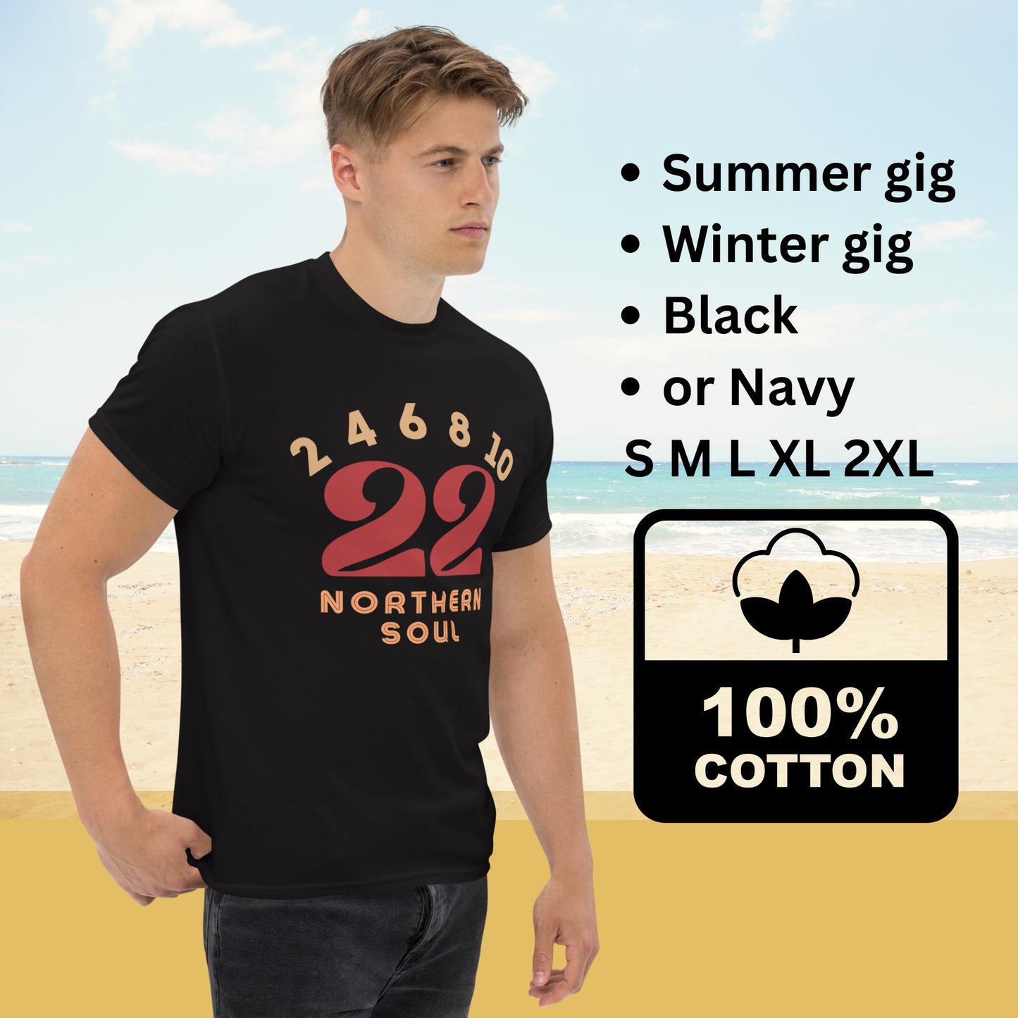 Man wearing a black t-shirt with red text on a beach background with text explaining sizing