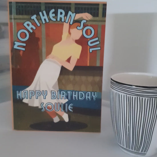 video of northern soul birthday card alongside a coffee mug