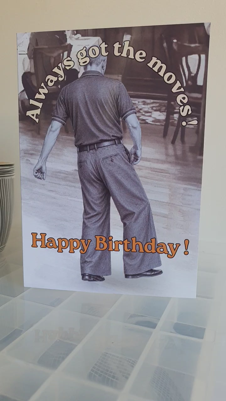 Video shows a card on a transparent work top depicting the monochrome image of northern soul man middle aged in polo shirt and wide leg trousers dancing with text stating always got the moves