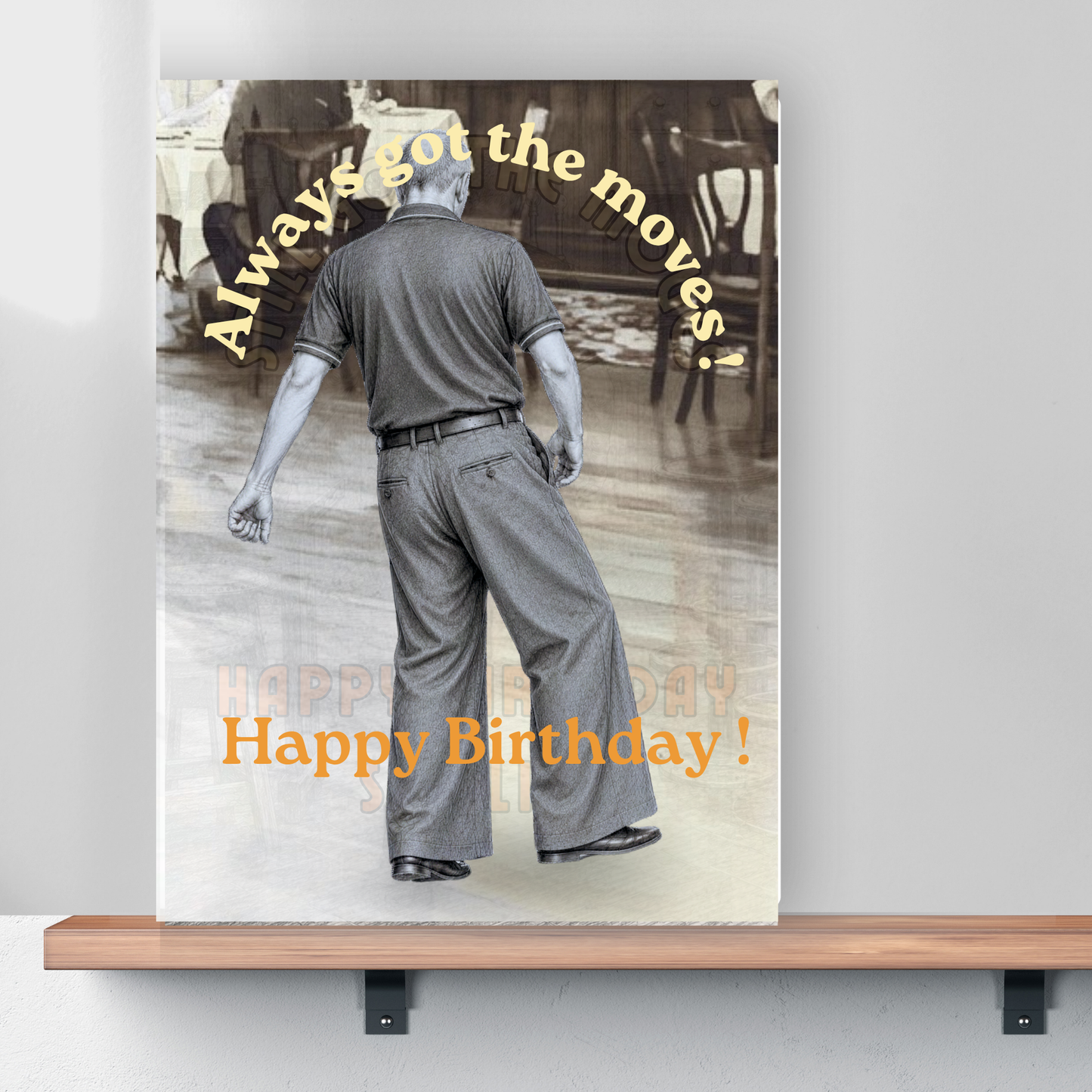 a card on a small wooden shelf depicting the monochrome image of northern soul man middle aged in polo shirt and wide leg trousers dancing with text stating always got the moves