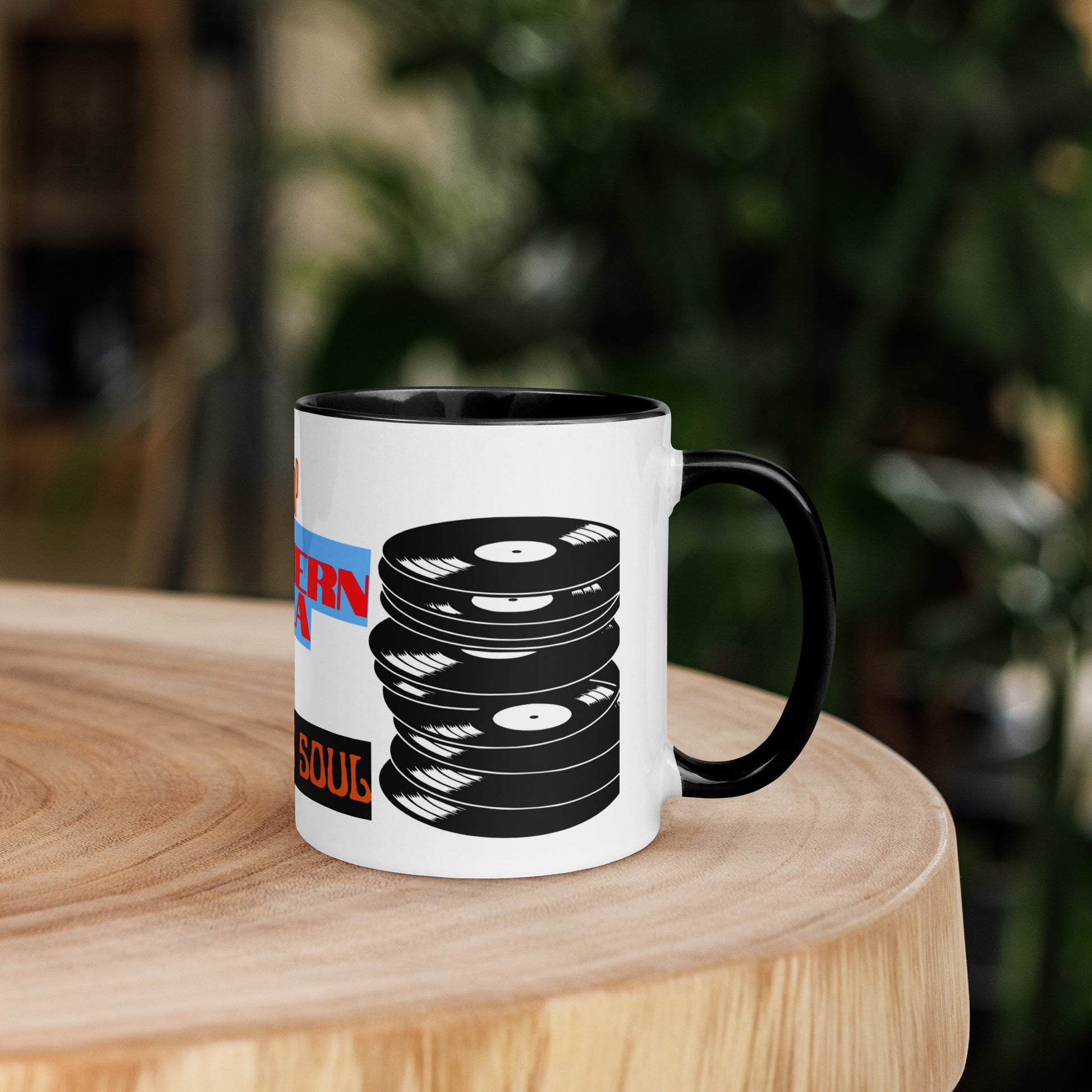 Mug with vinyl record design on a wooden surface