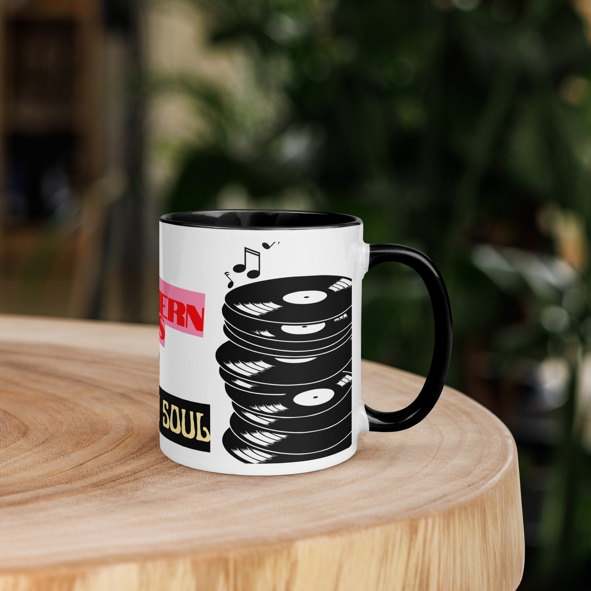 Mug with vinyl record design on a wooden surface