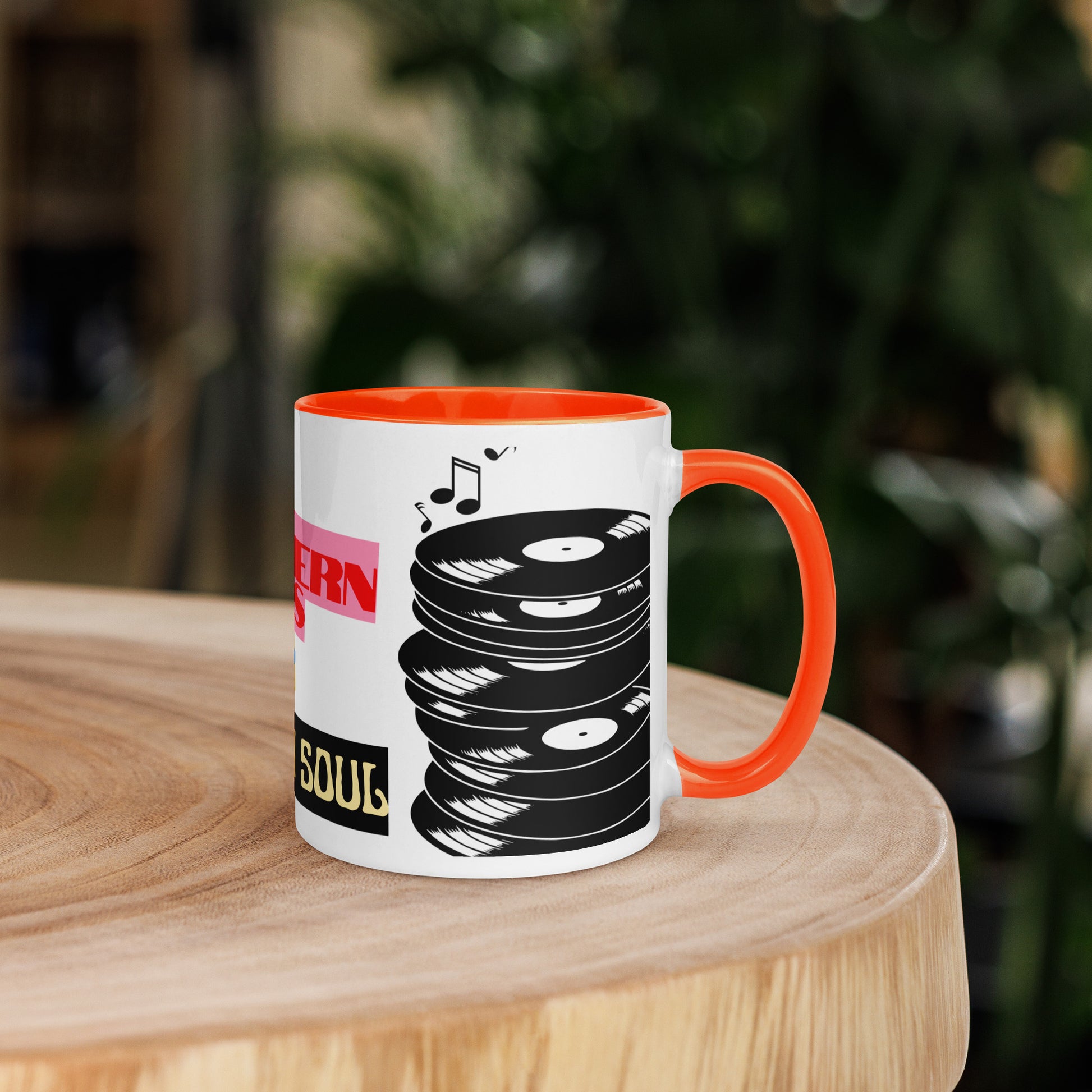 Mug with vinyl record design on a wooden surface