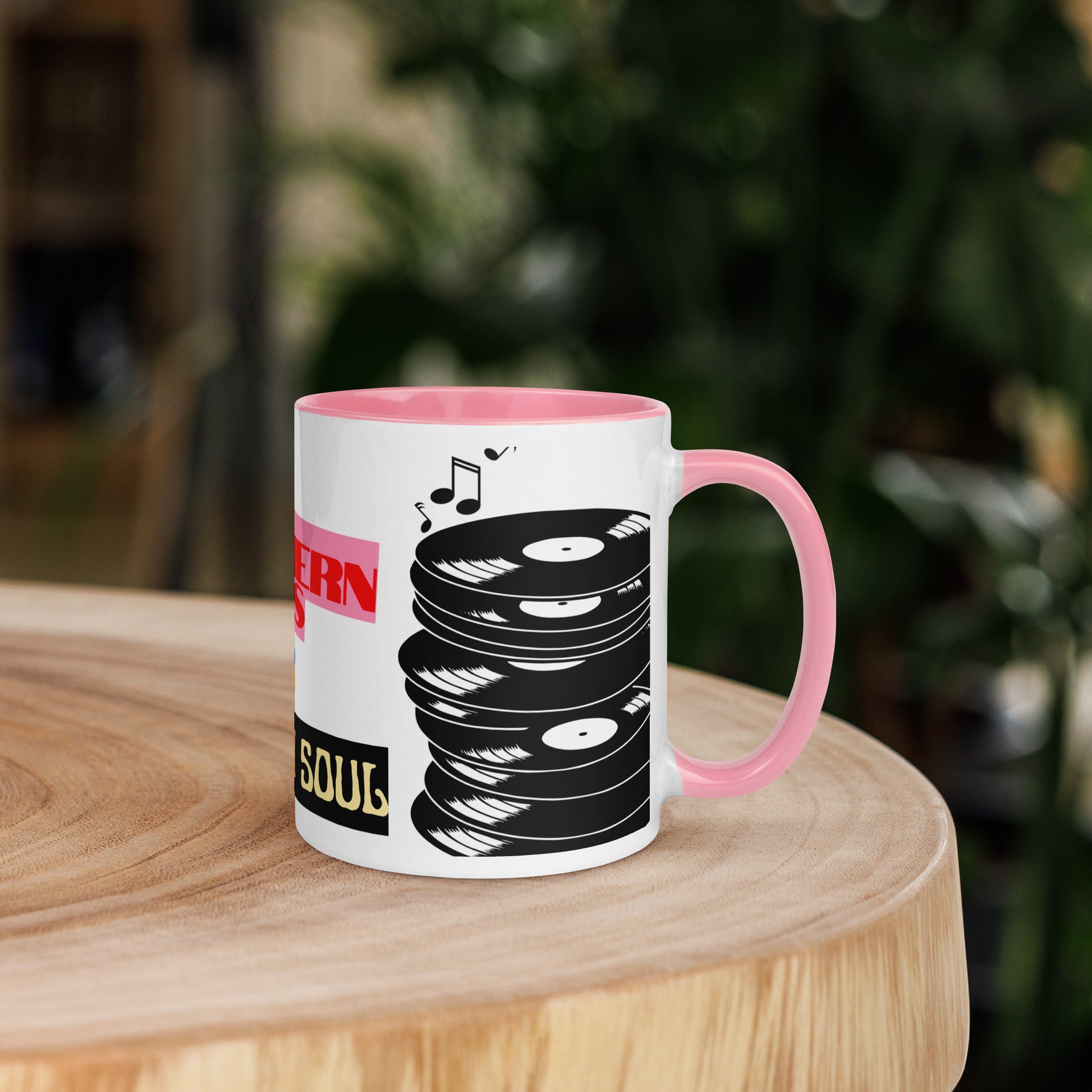Mug with vinyl record design on a wooden surface